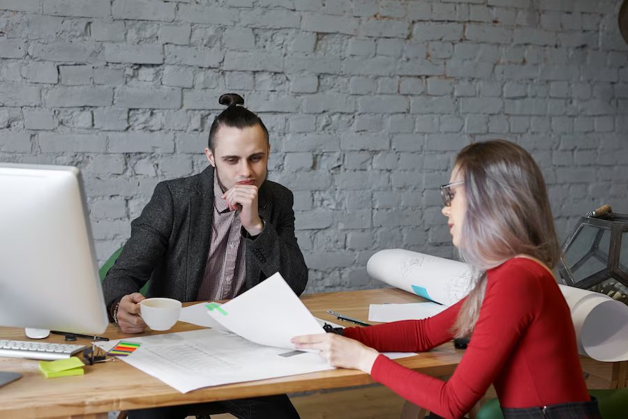 economist-shows-boss-architect-company-balance-money-building-new-shop_343059-1215